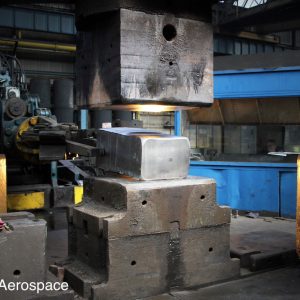 After heating, a billet is pre-formed prior to die forging